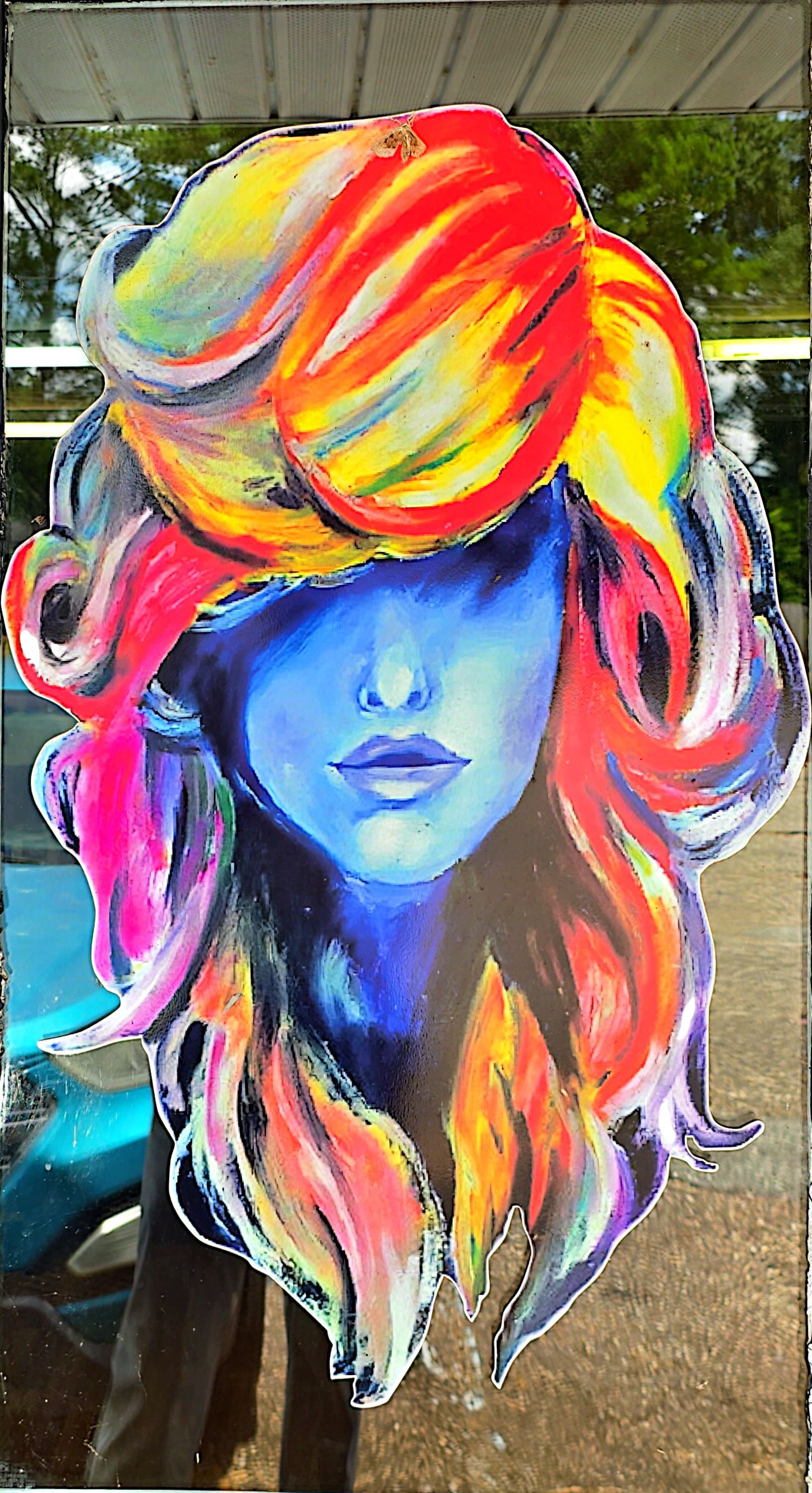 Stylist creating vibrant fashion color in salon